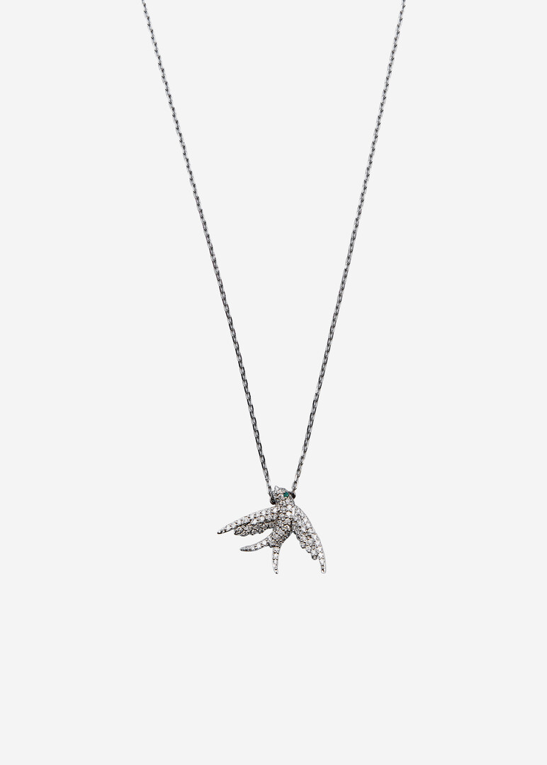 gold necklace with bird pendant and diamonds