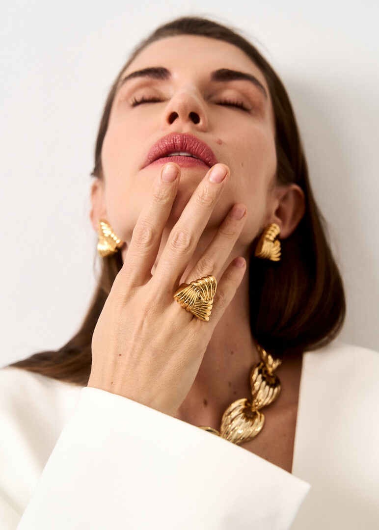 Golden triangular braided ring