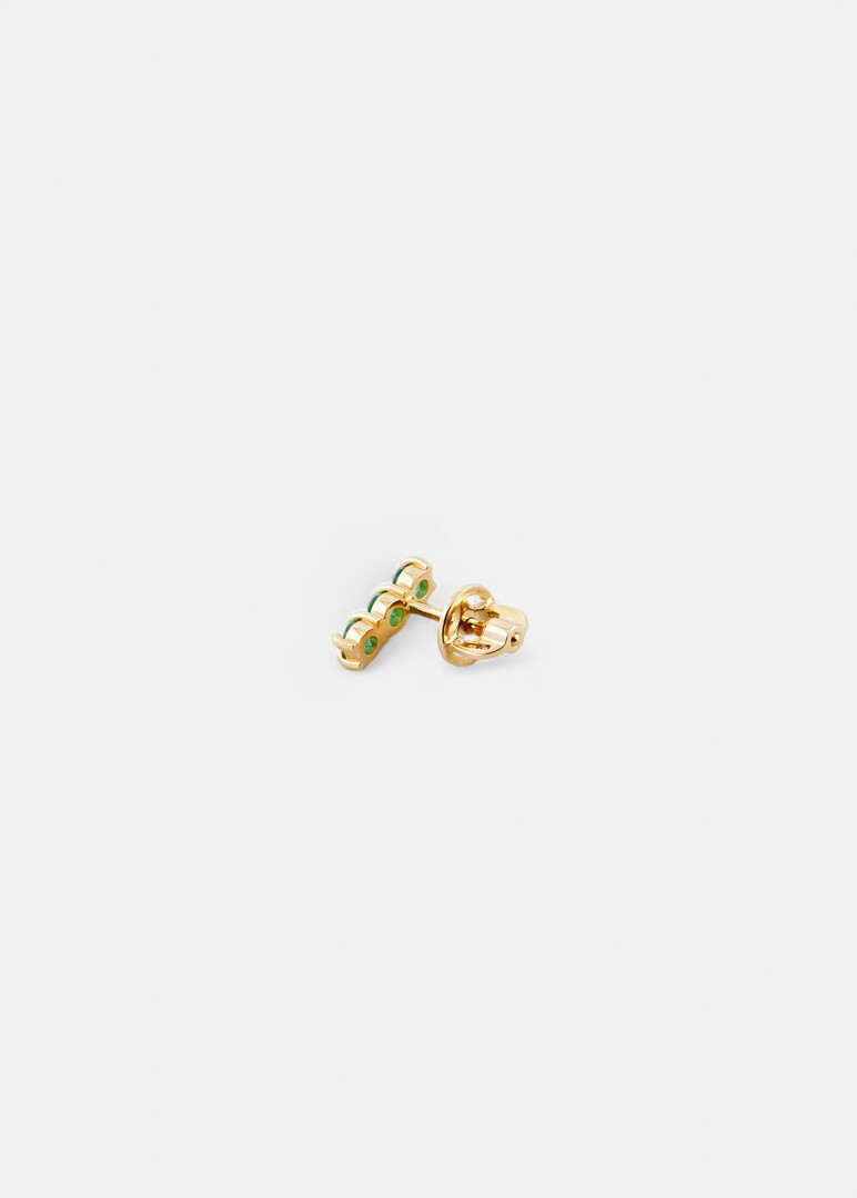 monoserge made of gold with emeralds