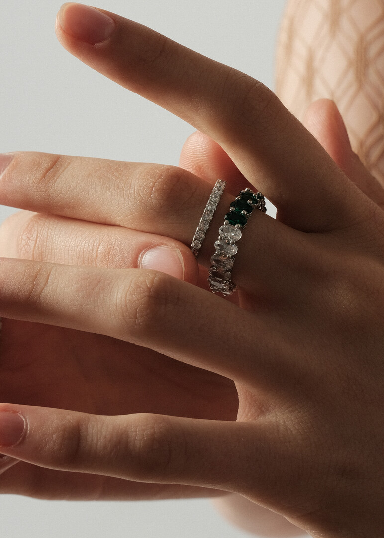 ring with ovals of white and green crystals