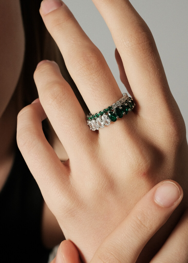 ring with ovals of white and green crystals
