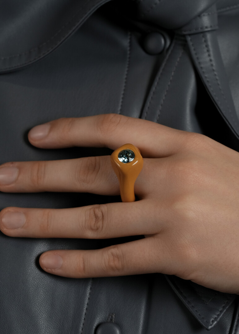 Ochre ring with blue crystal