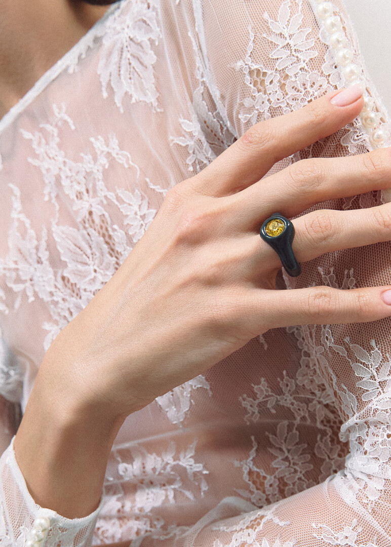 Black polymer clay ring with yellow rhinestone