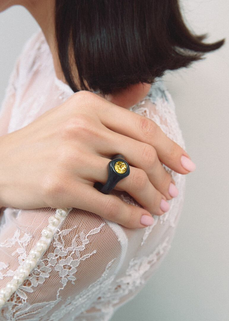 Black polymer clay ring with yellow rhinestone