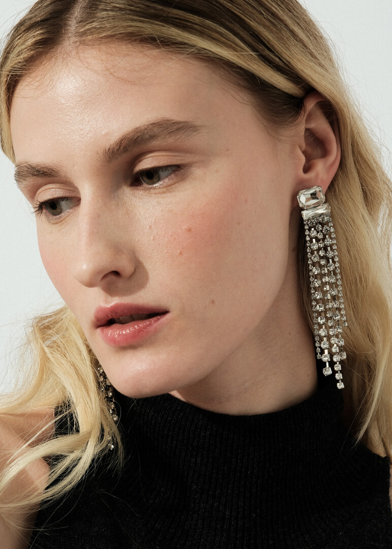 silver-tone earrings with large crystals and long tracks