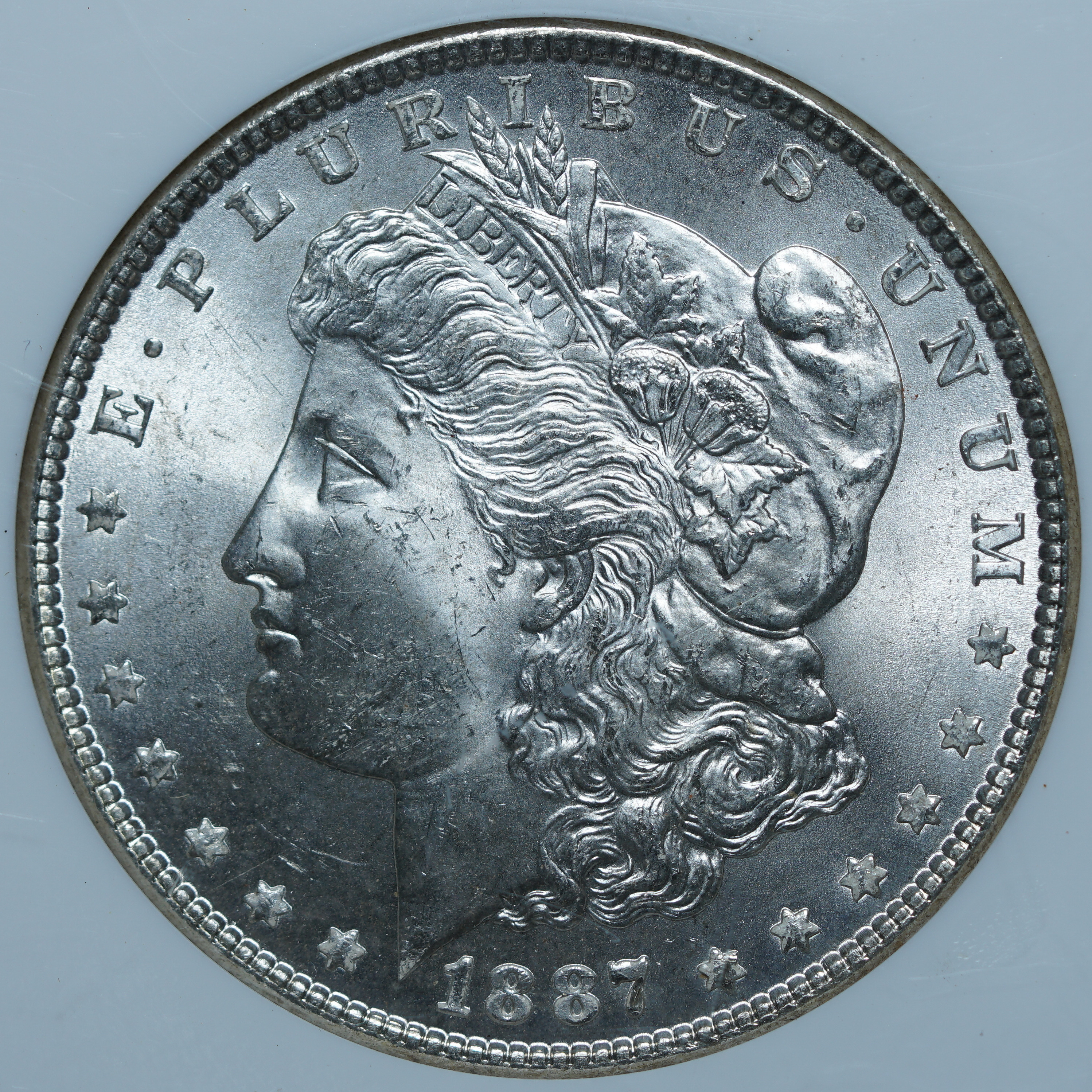 1 доллар 1887 MS64 NGC