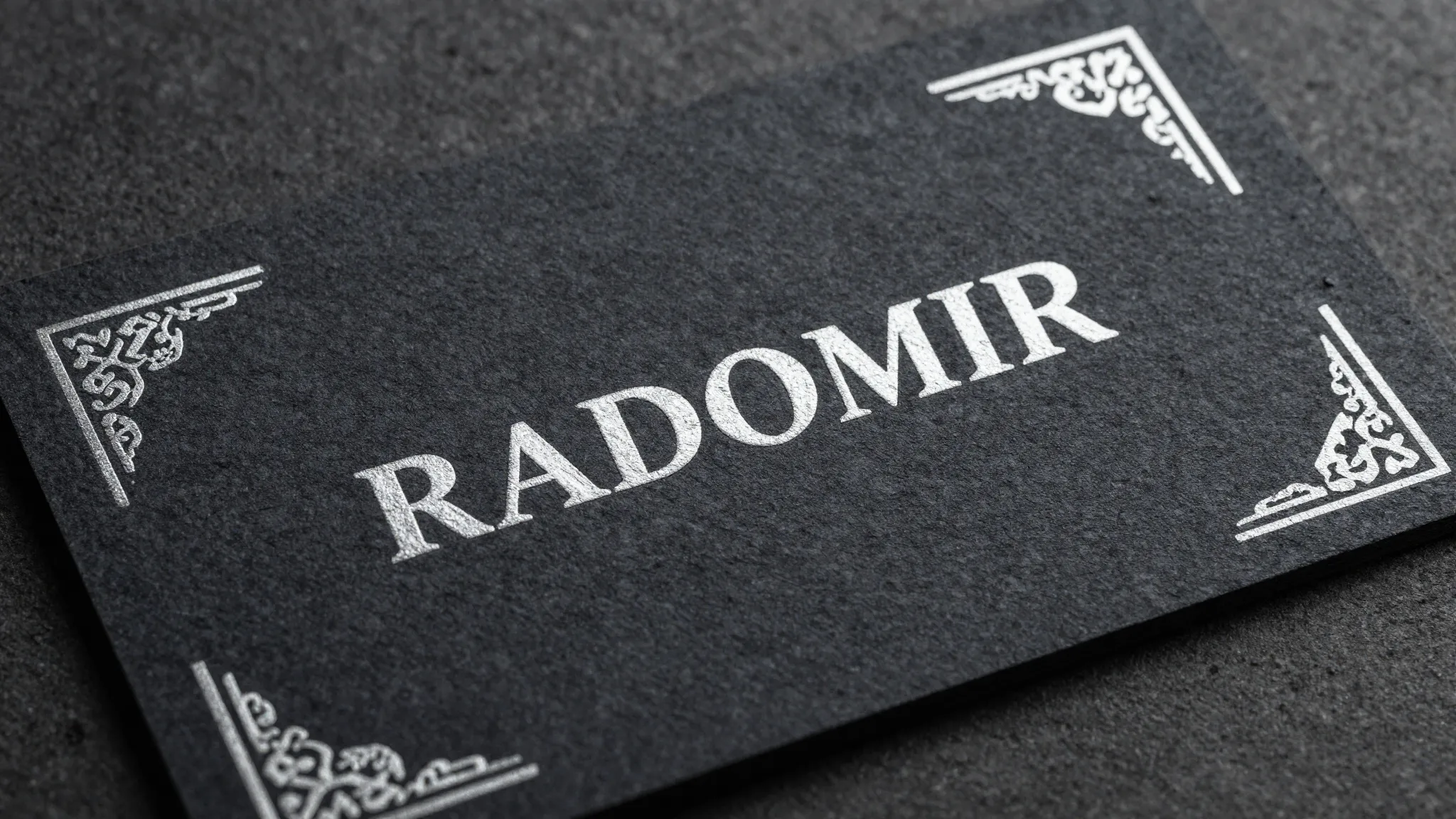 A premium business card design for 'RADOMIR', heavy textured...