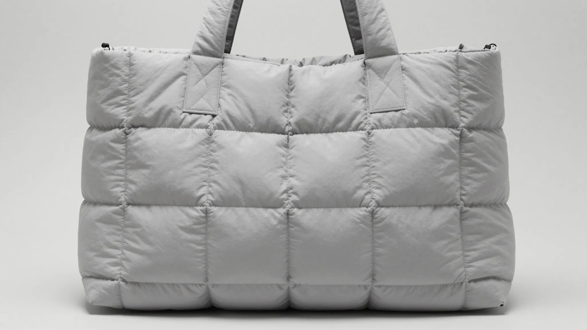 Minimalist quilted tote bag, oversized puffy design like a s...