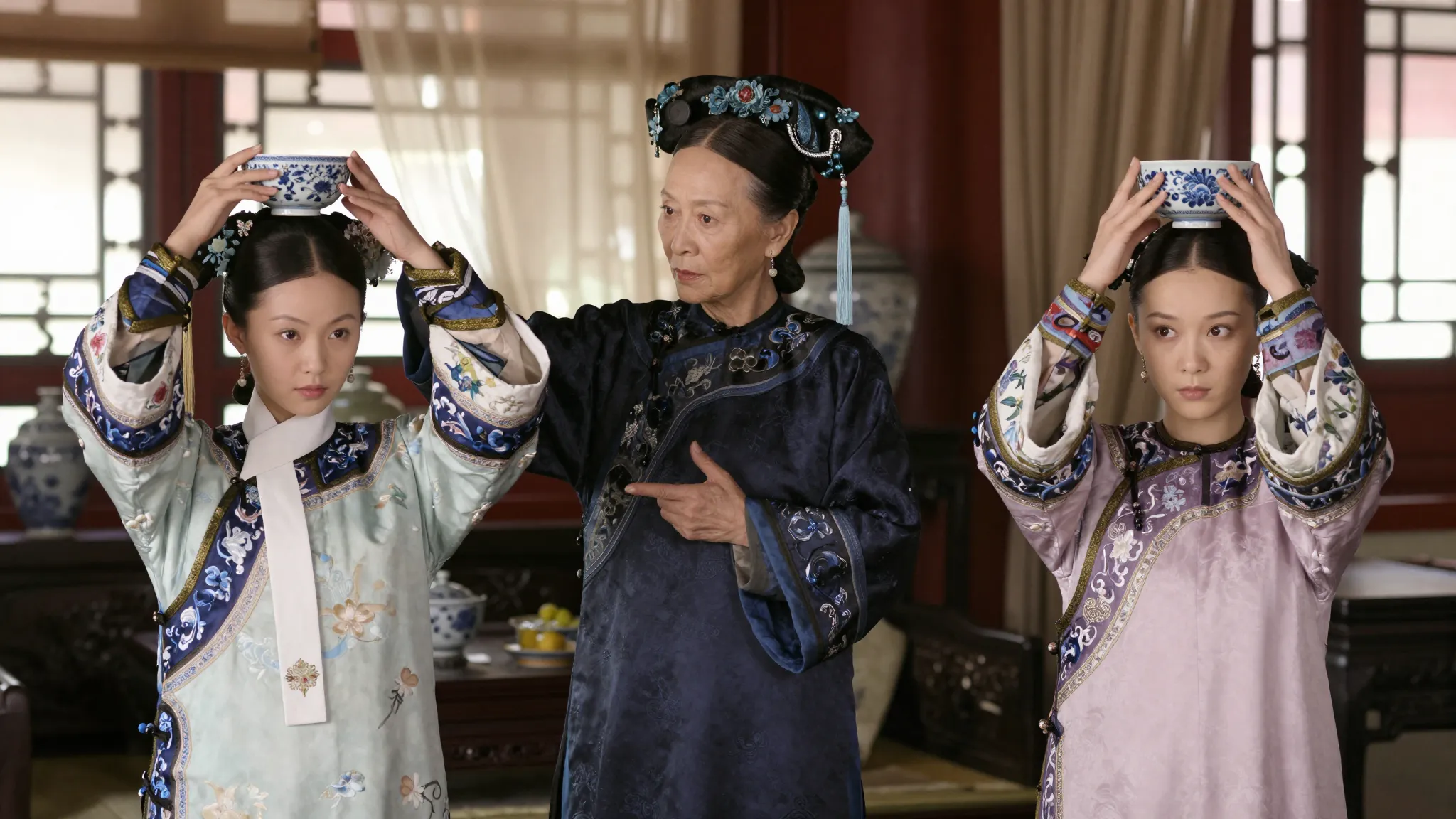 A stern elderly Chinese governess in dark traditional robes ...