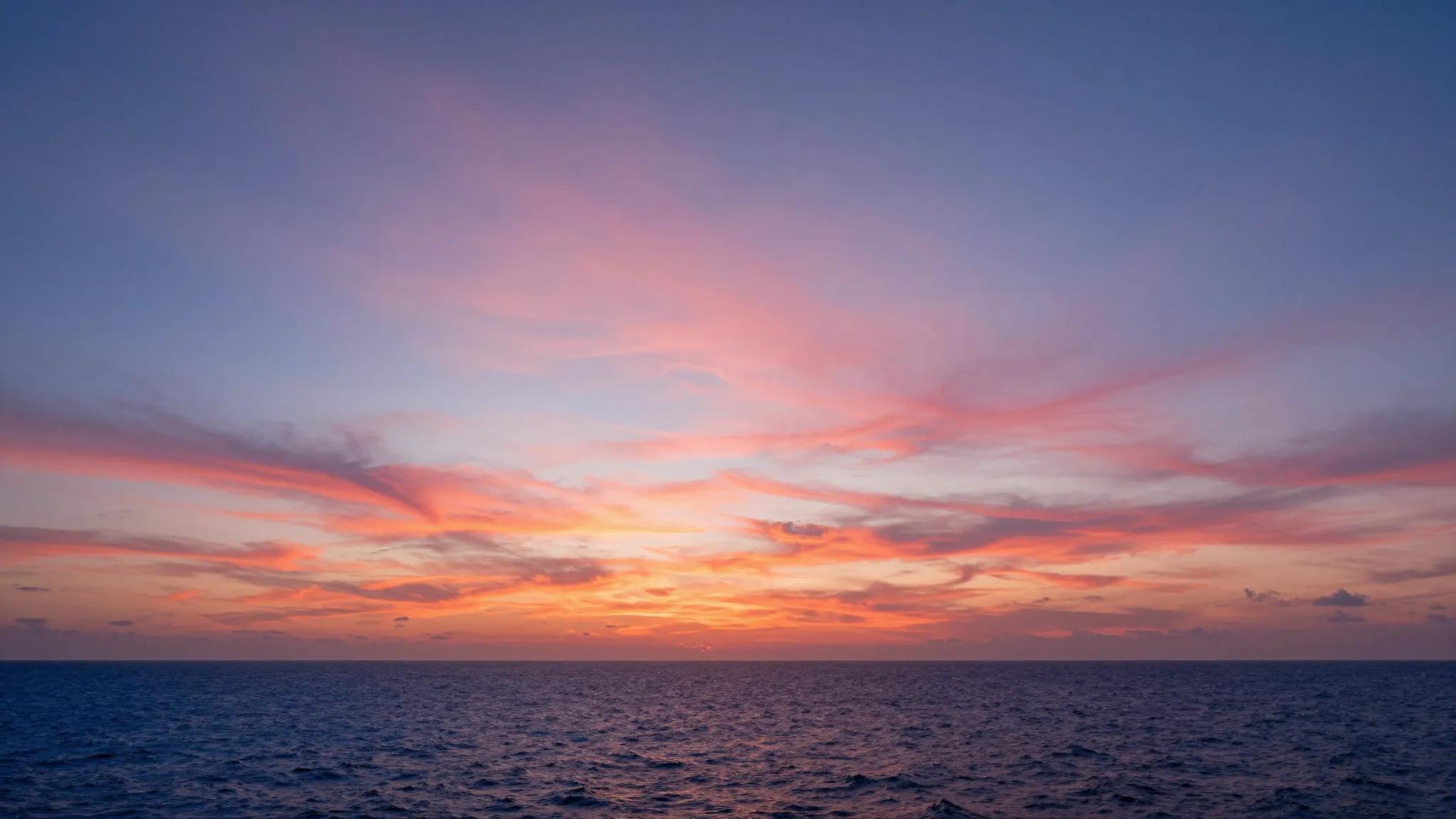 Epic coastal sunset with cirrus clouds stretching across the...