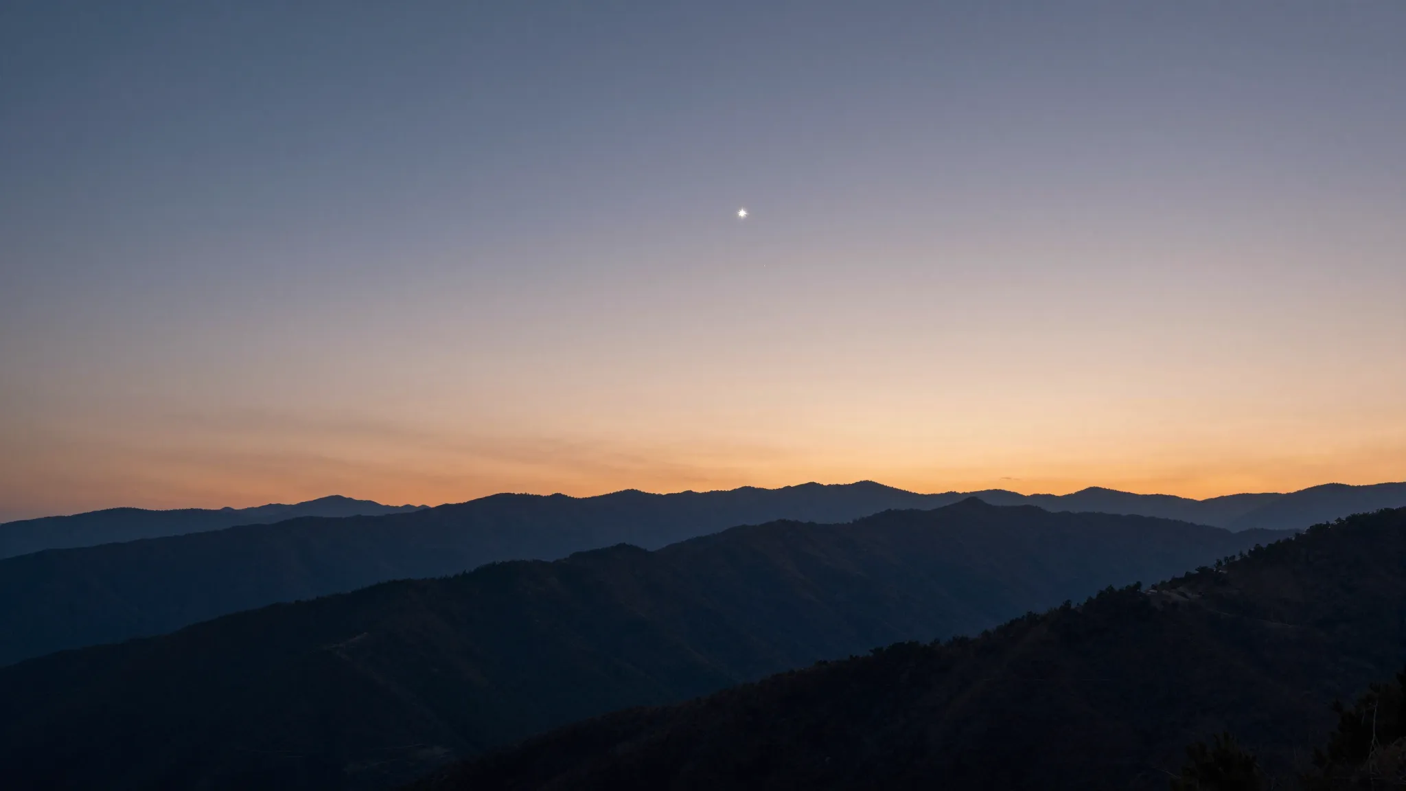 A serene and peaceful mountain landscape at sunset, two brig...