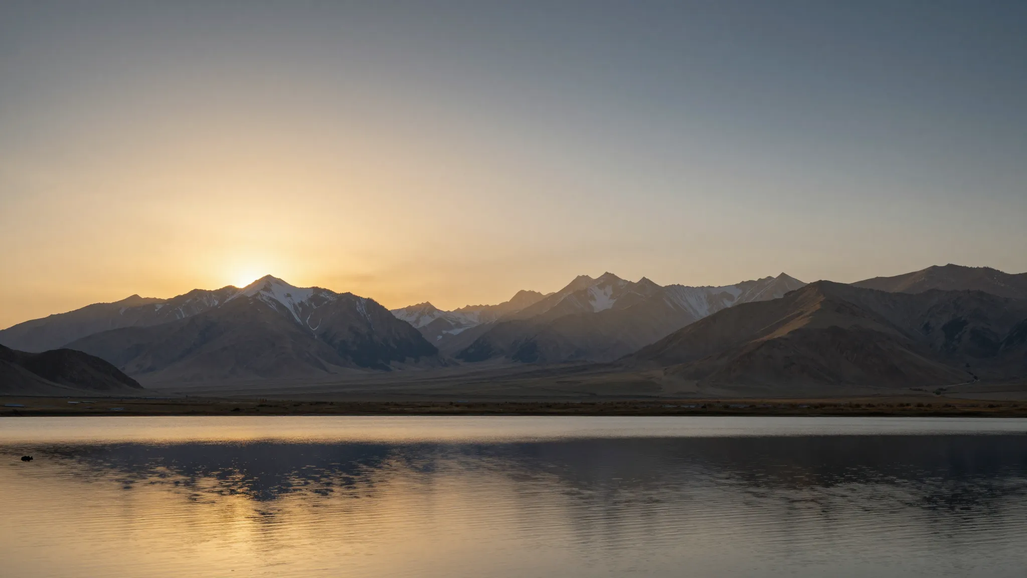 A peaceful landscape of Kyrgyz mountains at sunrise, a calm ...