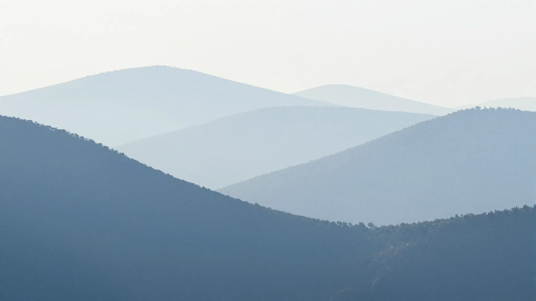 A soothing abstract background with soft blue and white wave...