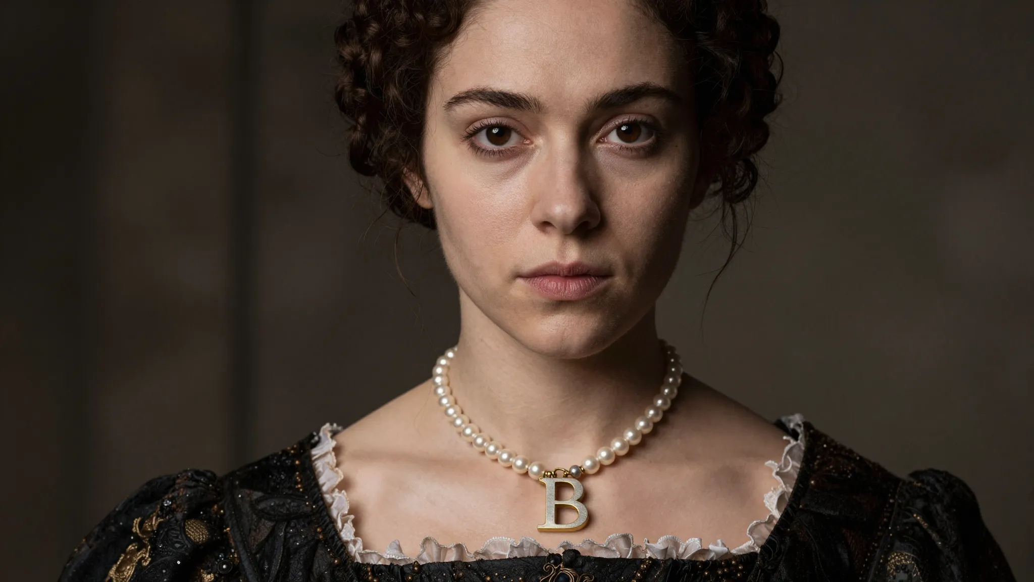 Portrait of a determined young woman with dark hair and dark...