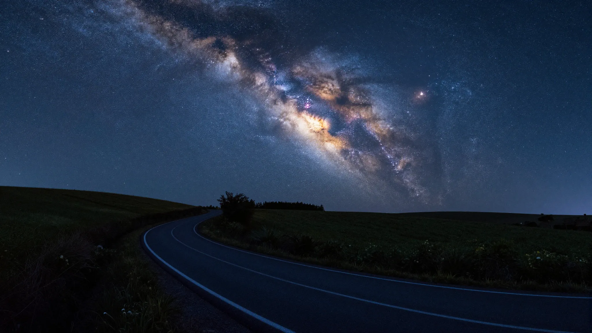 A winding night country road in the countryside smoothly tra...
