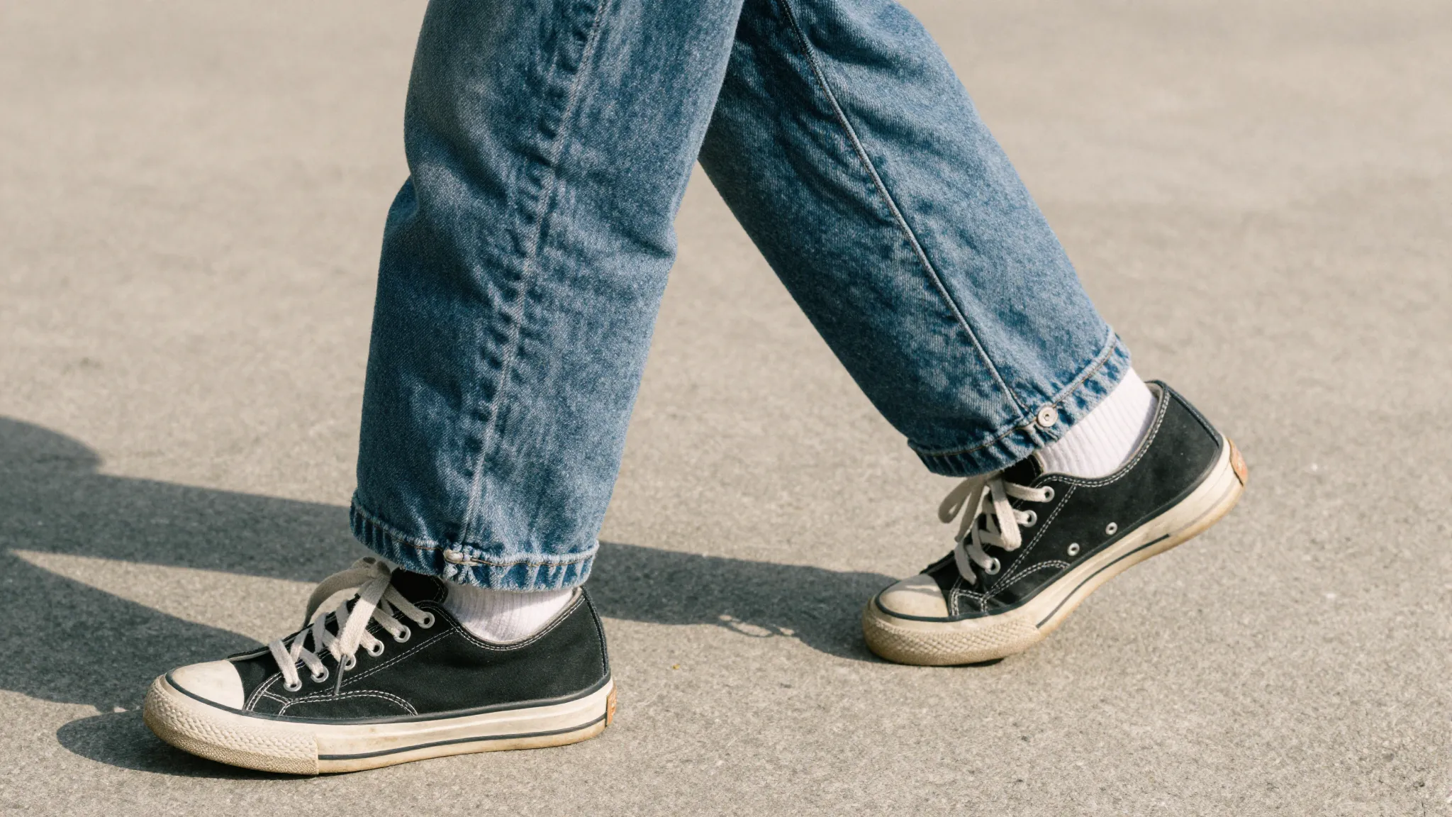 Close-up of a teenager's legs from the waist down, captured ...