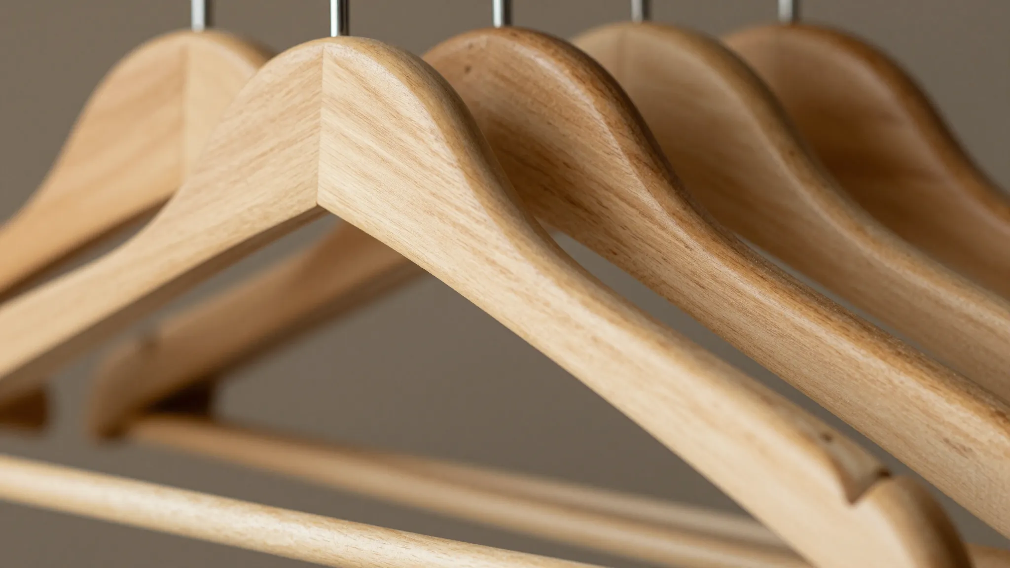 Close-up of a wooden clothes hanger texture, solid pine wood...