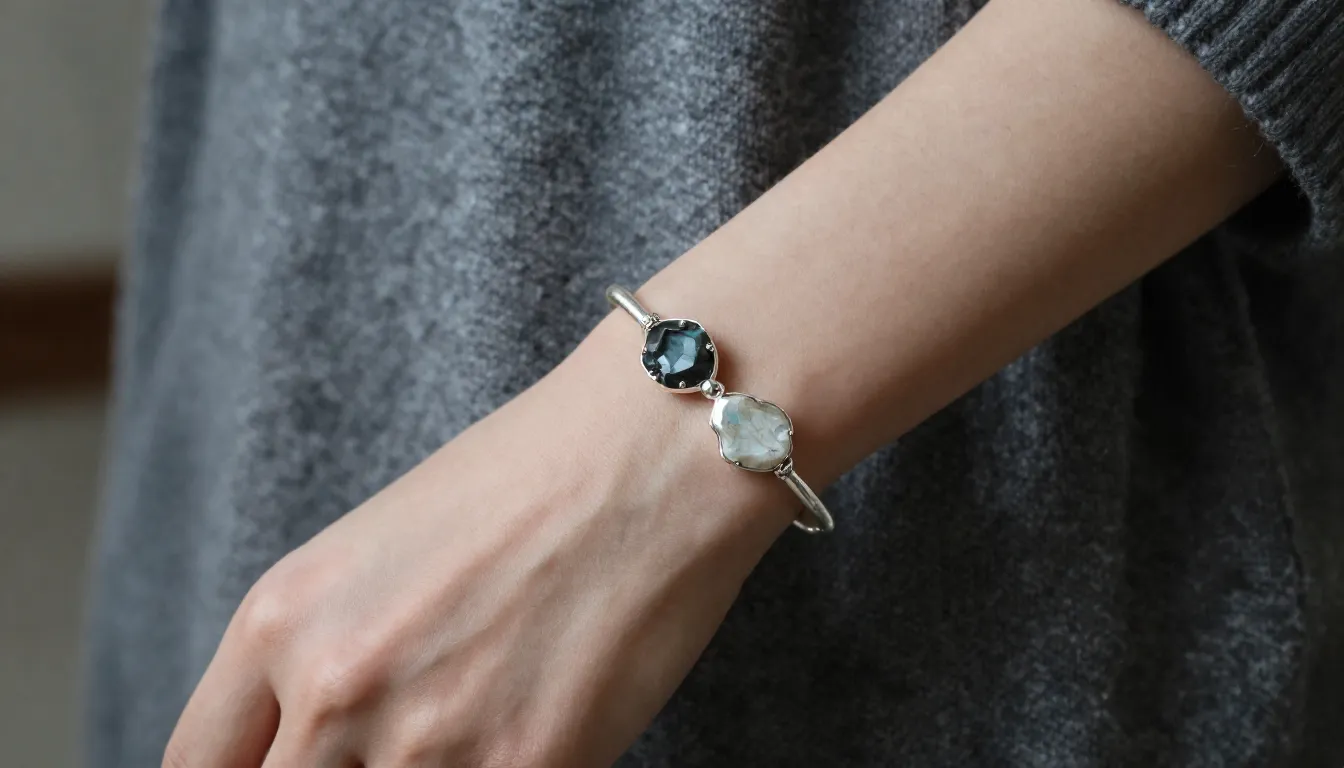 Close-up of a unique handmade silver bracelet with raw natur...