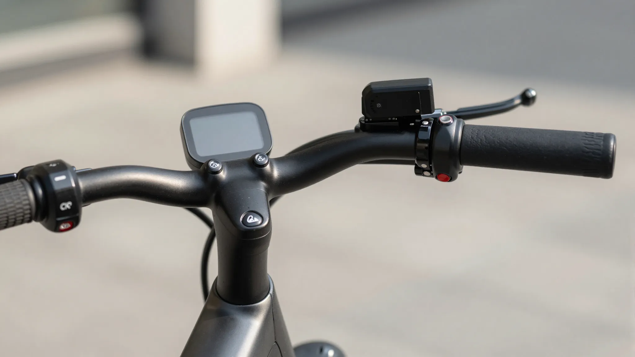 Detailed close-up of a modern electric bike dashboard and ha...