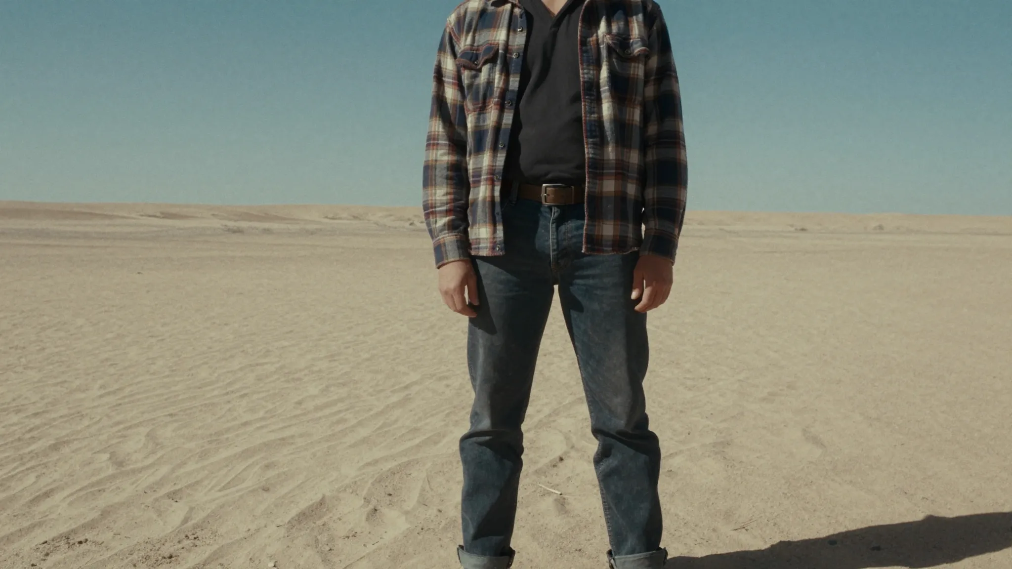 Grunge aesthetic meets desert rock, a person in a flannel sh...