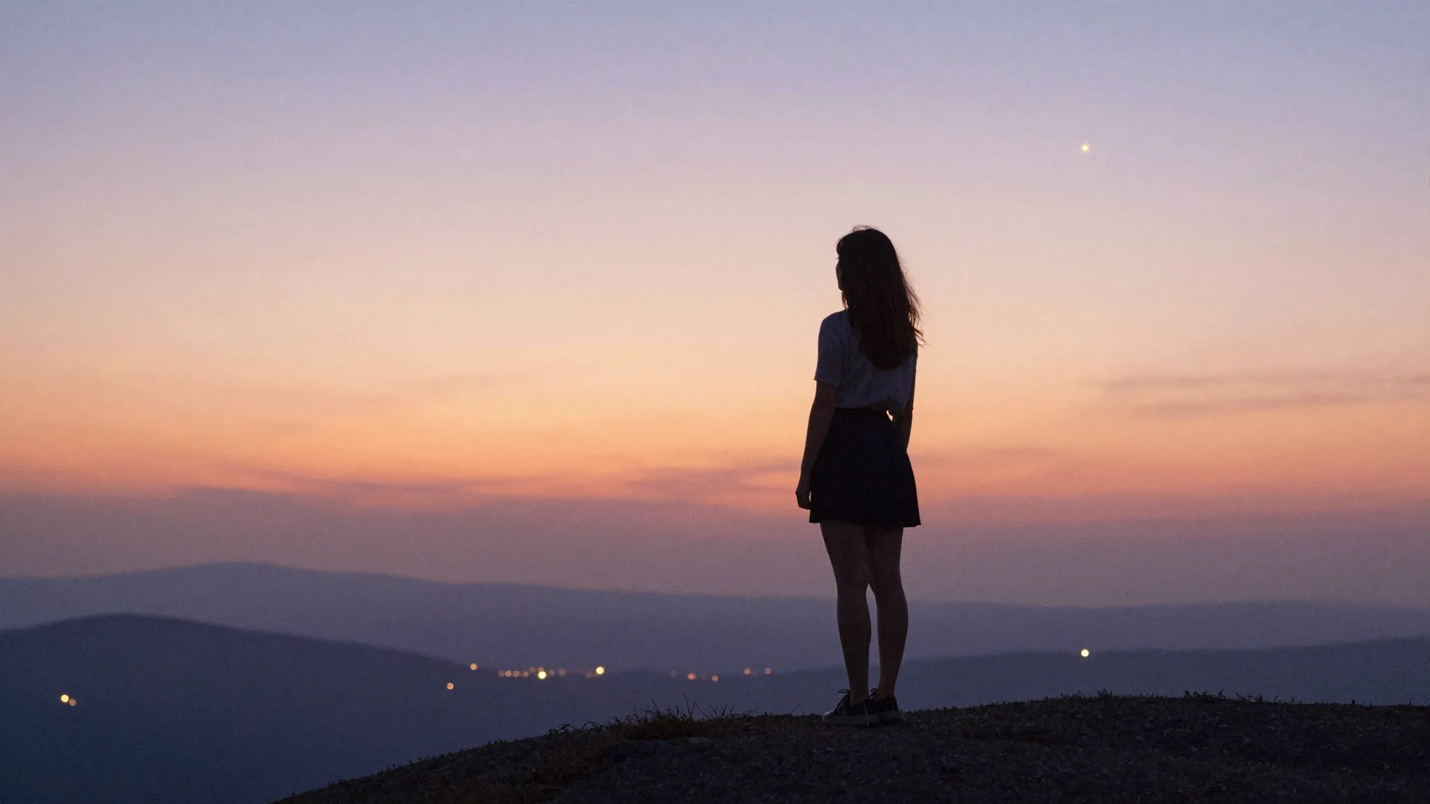 Watercolor style. A silhouette of a woman stands on a hill, ...