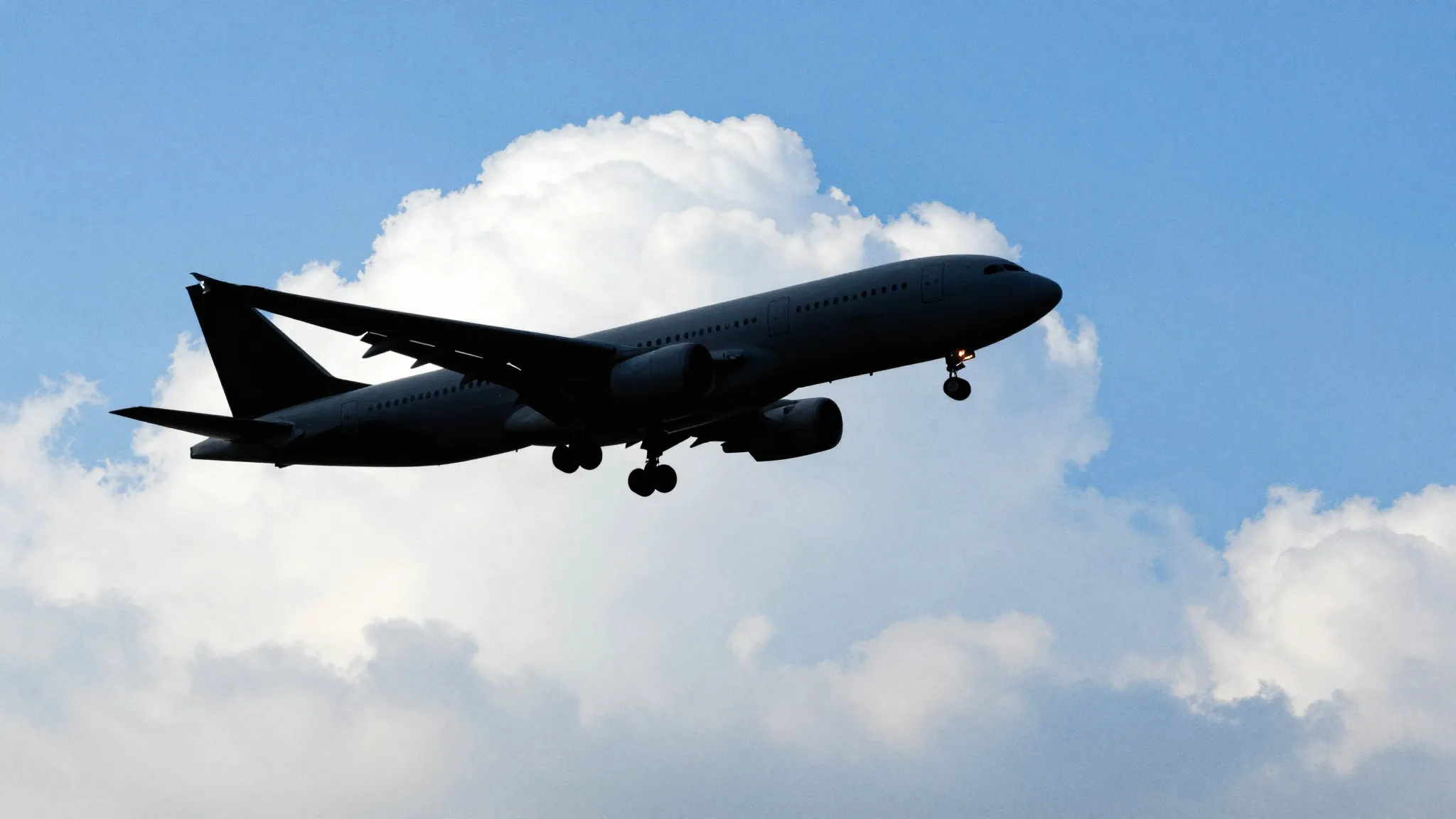 Watercolor style. Silhouette of a large passenger plane flyi...