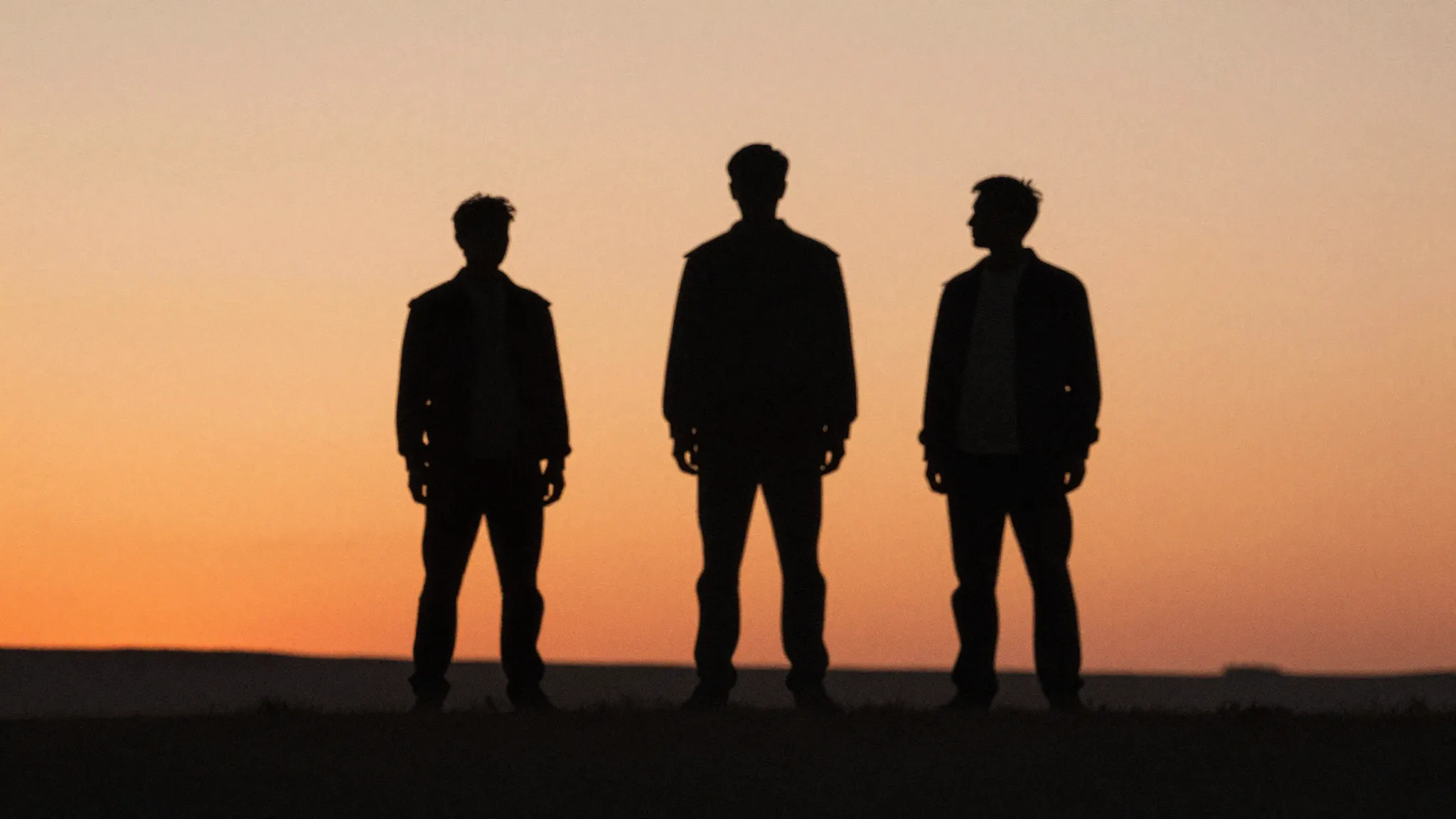 Watercolor style. Three silhouettes of men from different er...