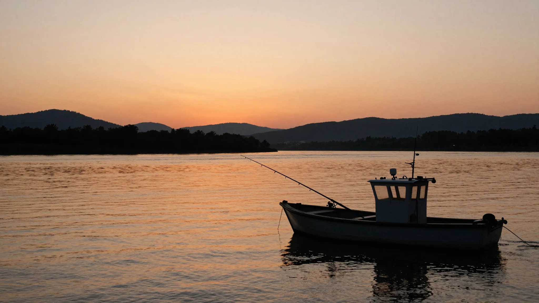 Watercolor style. A silhouette of a fishing boat on a wide r...