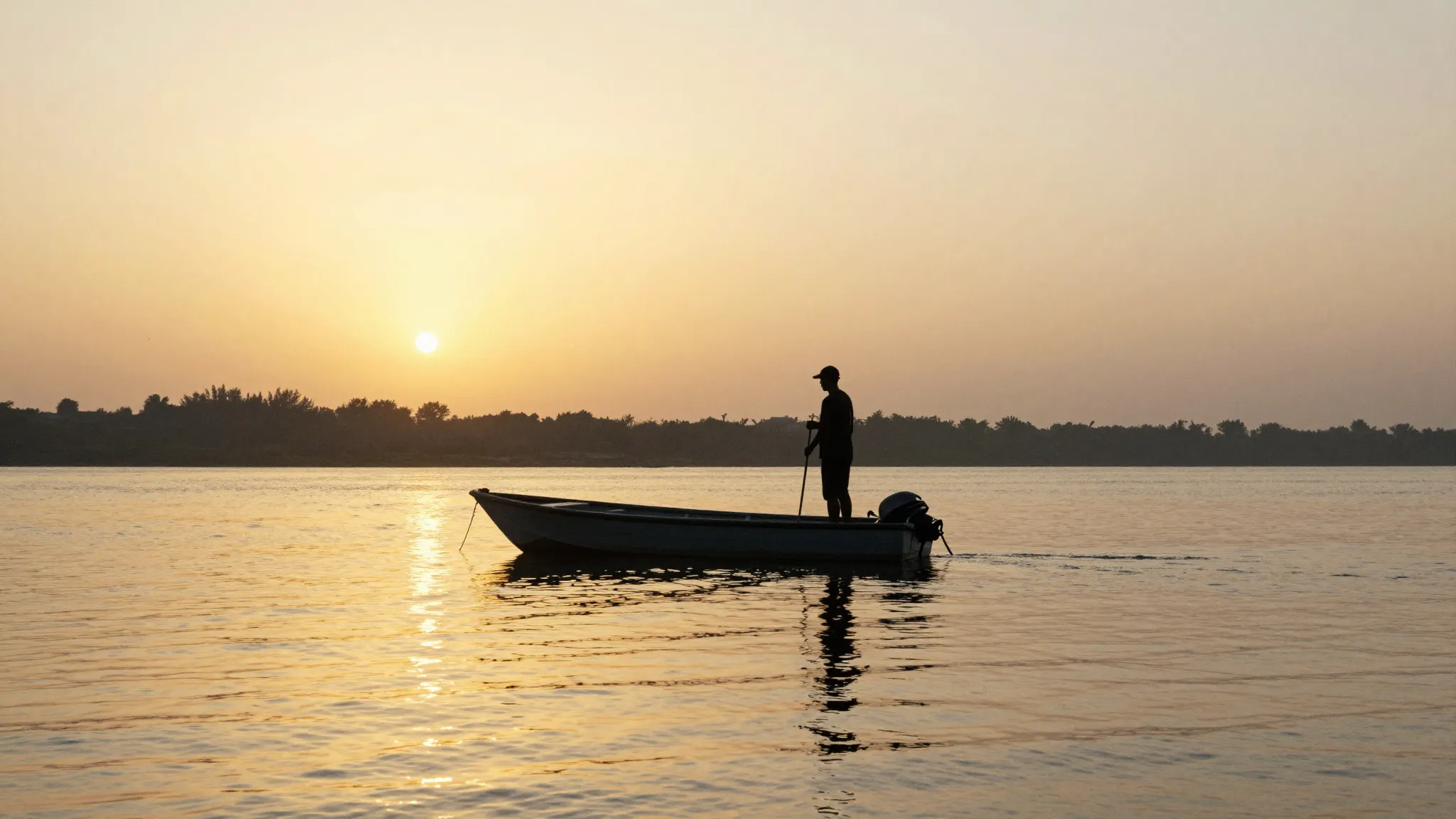 Watercolor style. A silhouette of a fisherman standing in a ...