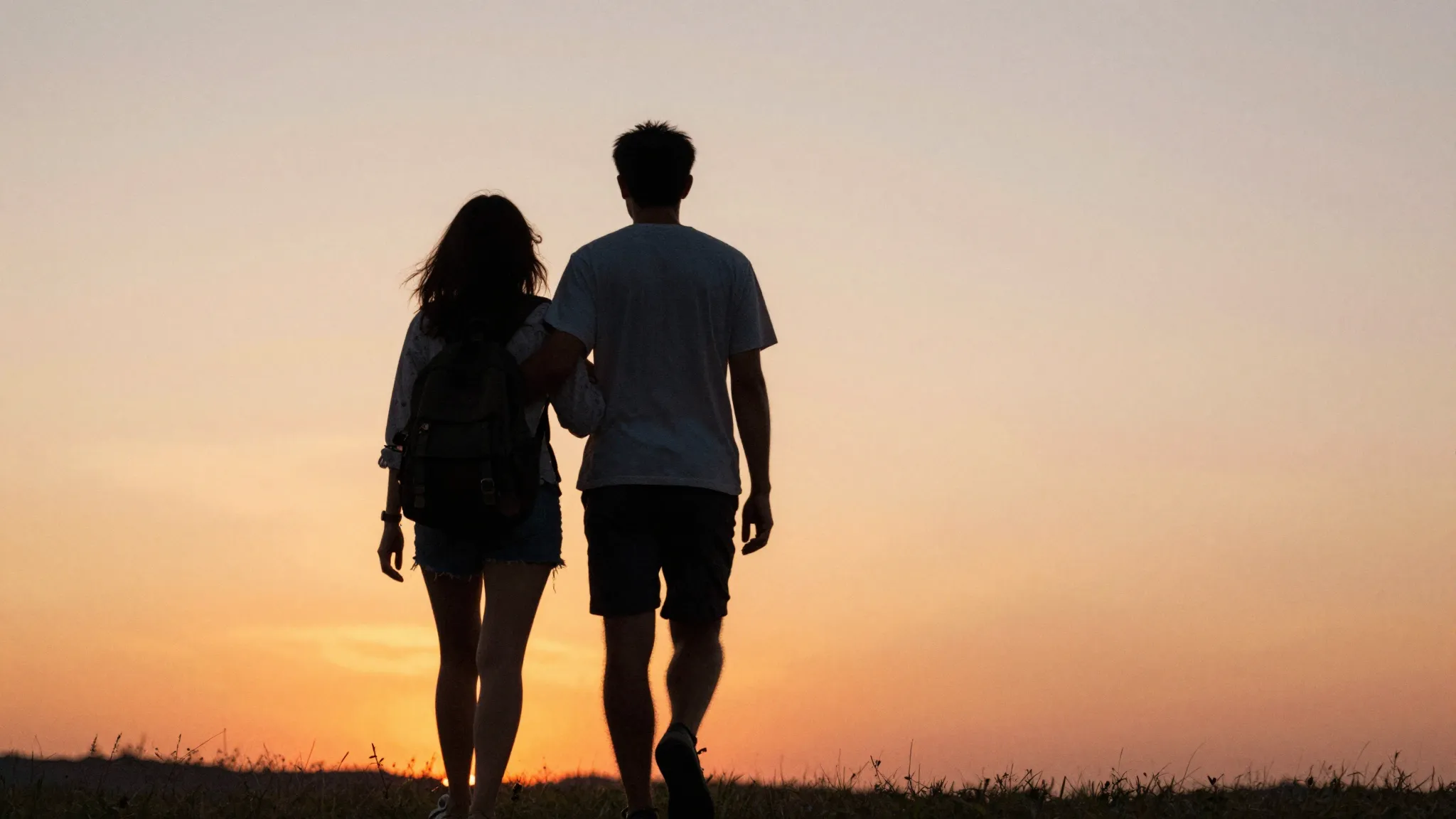 Watercolor style. A silhouette of a couple walking away into...