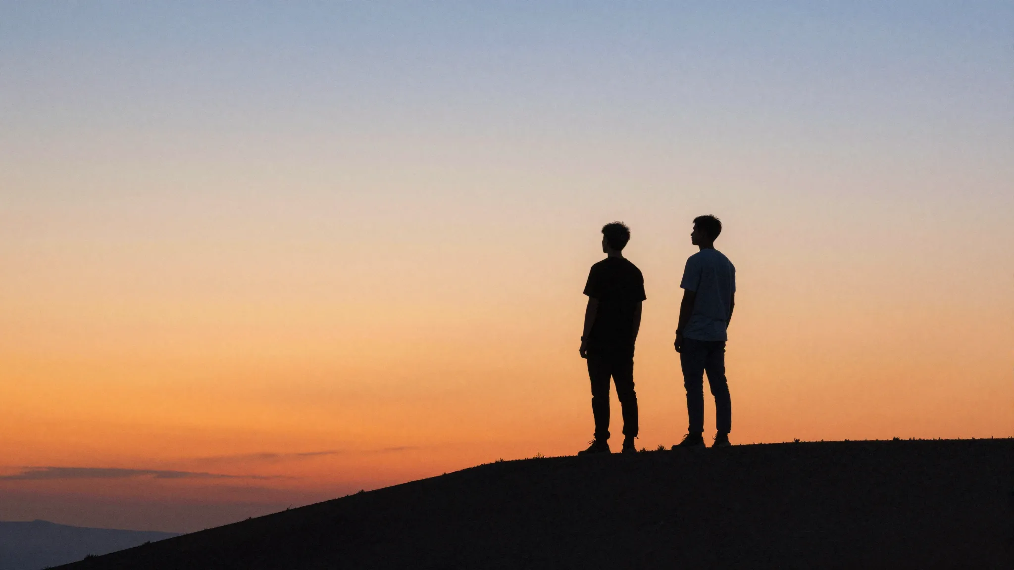 Watercolor style. Two silhouettes of young men standing on a...