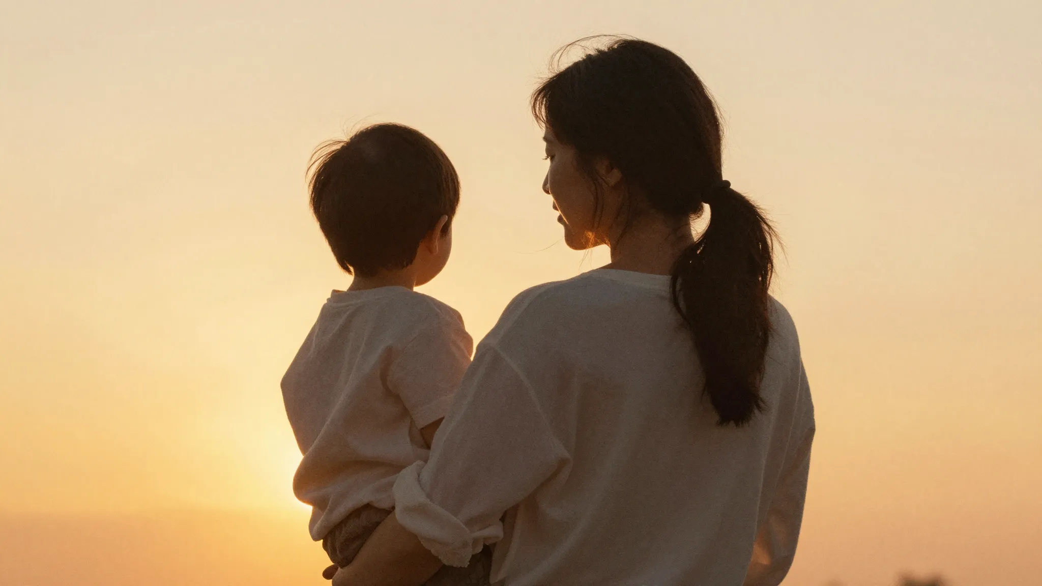 Watercolor style. A warm silhouette of a mother and child lo...