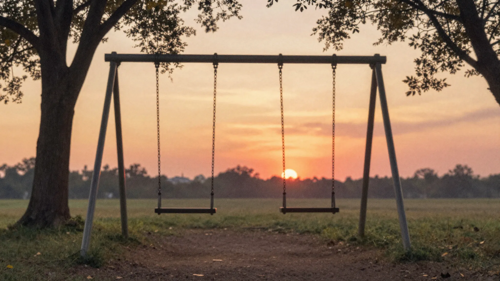 Watercolor style. A silhouette of a swing in a park at sunse...