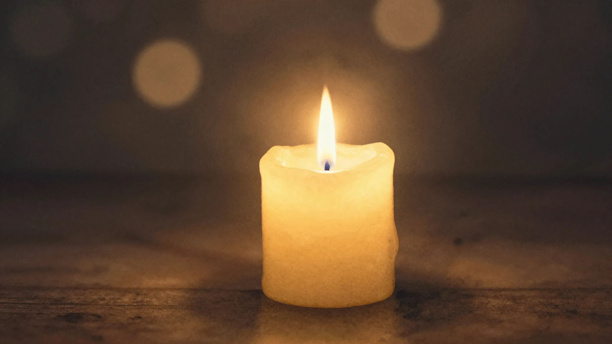 Watercolor style. A single glowing candle flame in a dark sp...