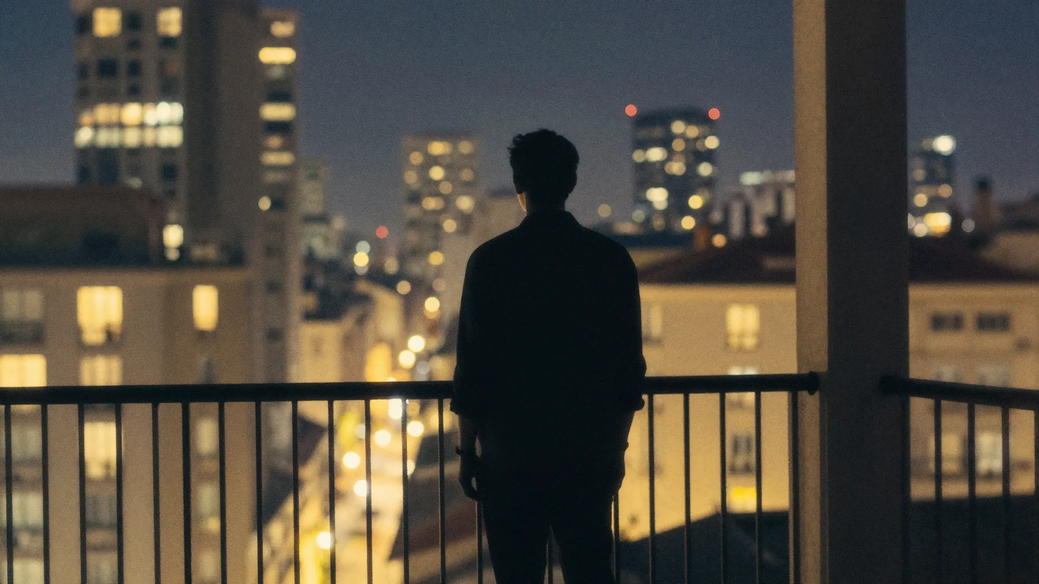 Watercolor style. Silhouette of a man standing on a city bal...