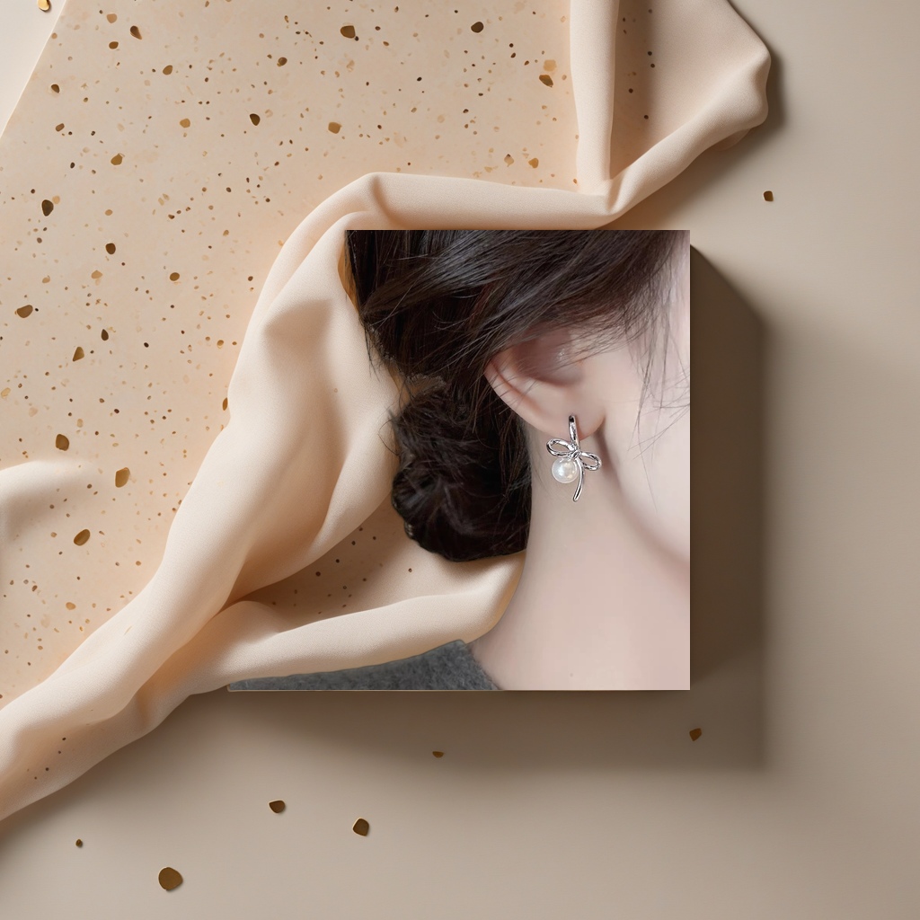 Серьги серебристые с бантом и жемчугом оптом из Китая — фотография 4