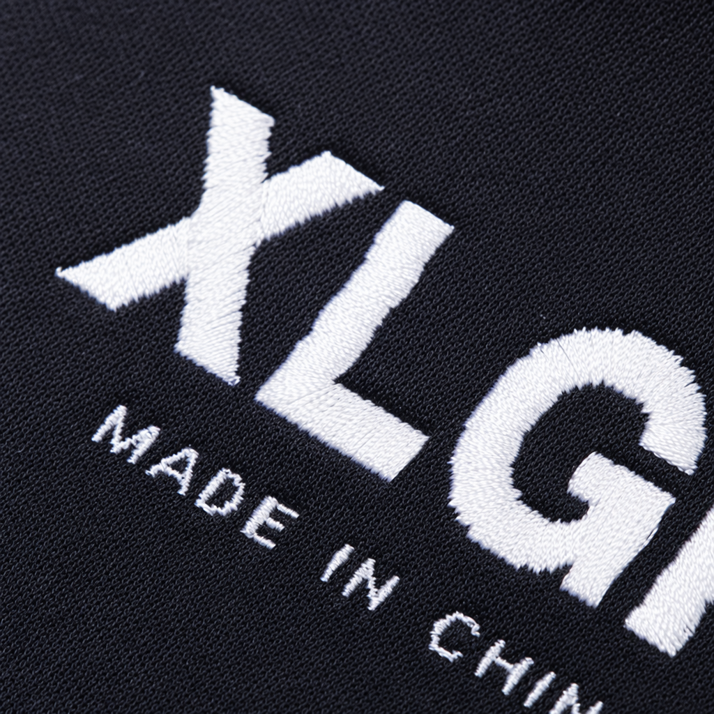 Этикетка тканая чёрная с надписью XLGK оптом из Китая — фотография 5