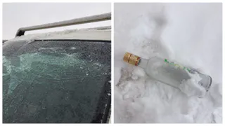 Неизвестные выбросили стеклянную бутылку на стекло автомобиля 