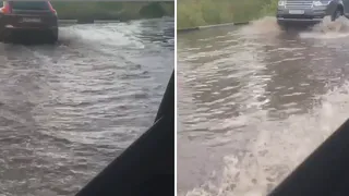 Последствия ливня: в Канищеве затопило улицу Бирюзова