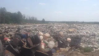 Полиция проводит проверку о незаконной свалке мусора в Турлатово