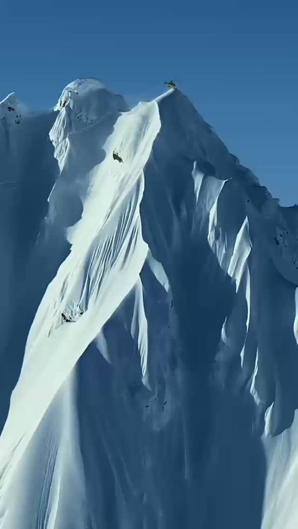 Steep snow face of a mountain