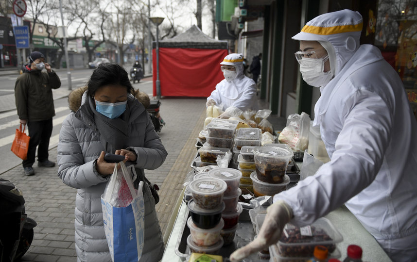 Жители Пекина. Фото AFP