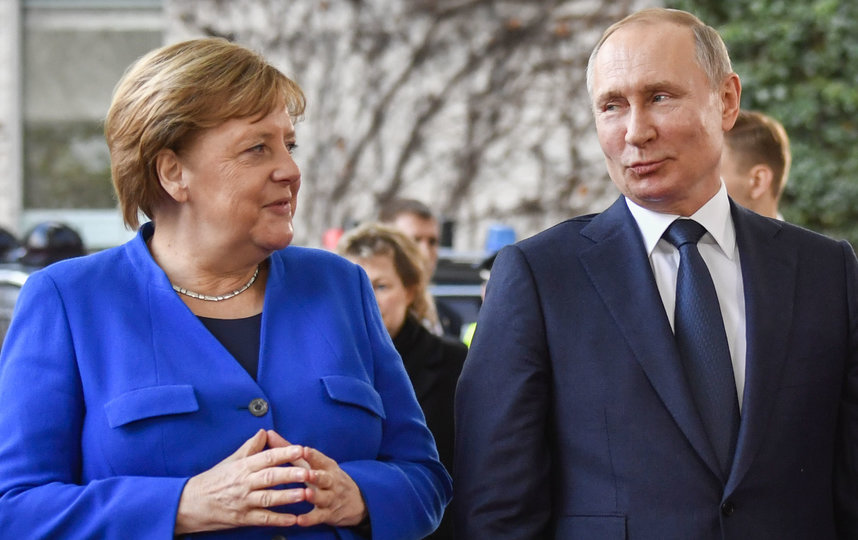 Ангела Меркель и Владимир Путин на Берлинской конференции. Фото AFP