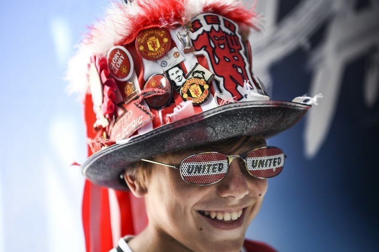 Фанаты готовятся к матчу "Реал" Мадрид – "Манчестер Юнайтед" 8 августа 2017 года. Фото AFP