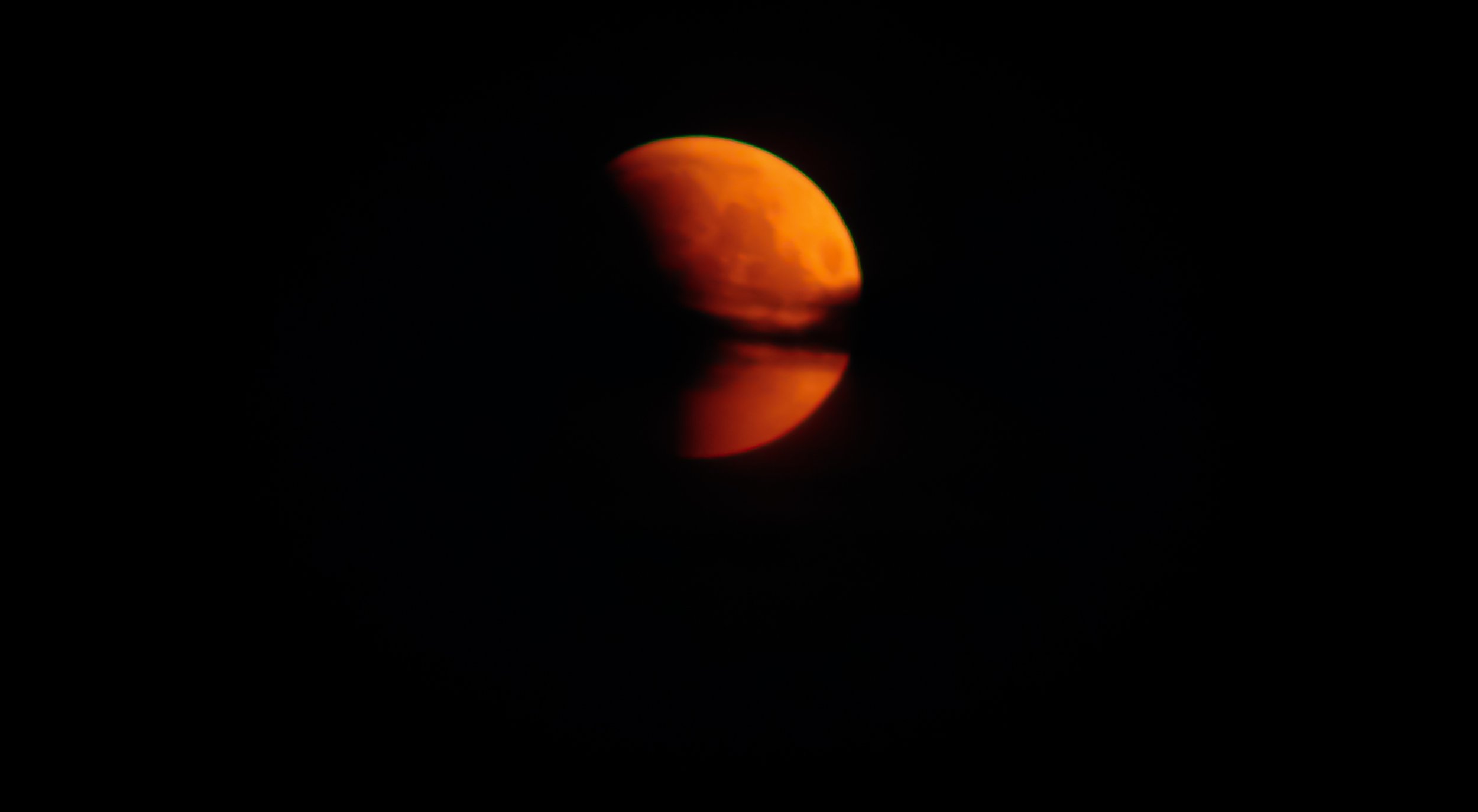 Lunar eclipse in the July evening