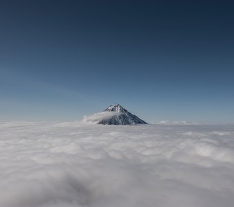 В облаках.