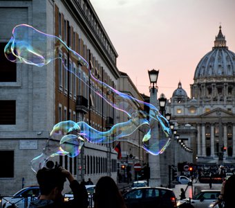 Great soap bubble in front of the St. Peter's Basilica