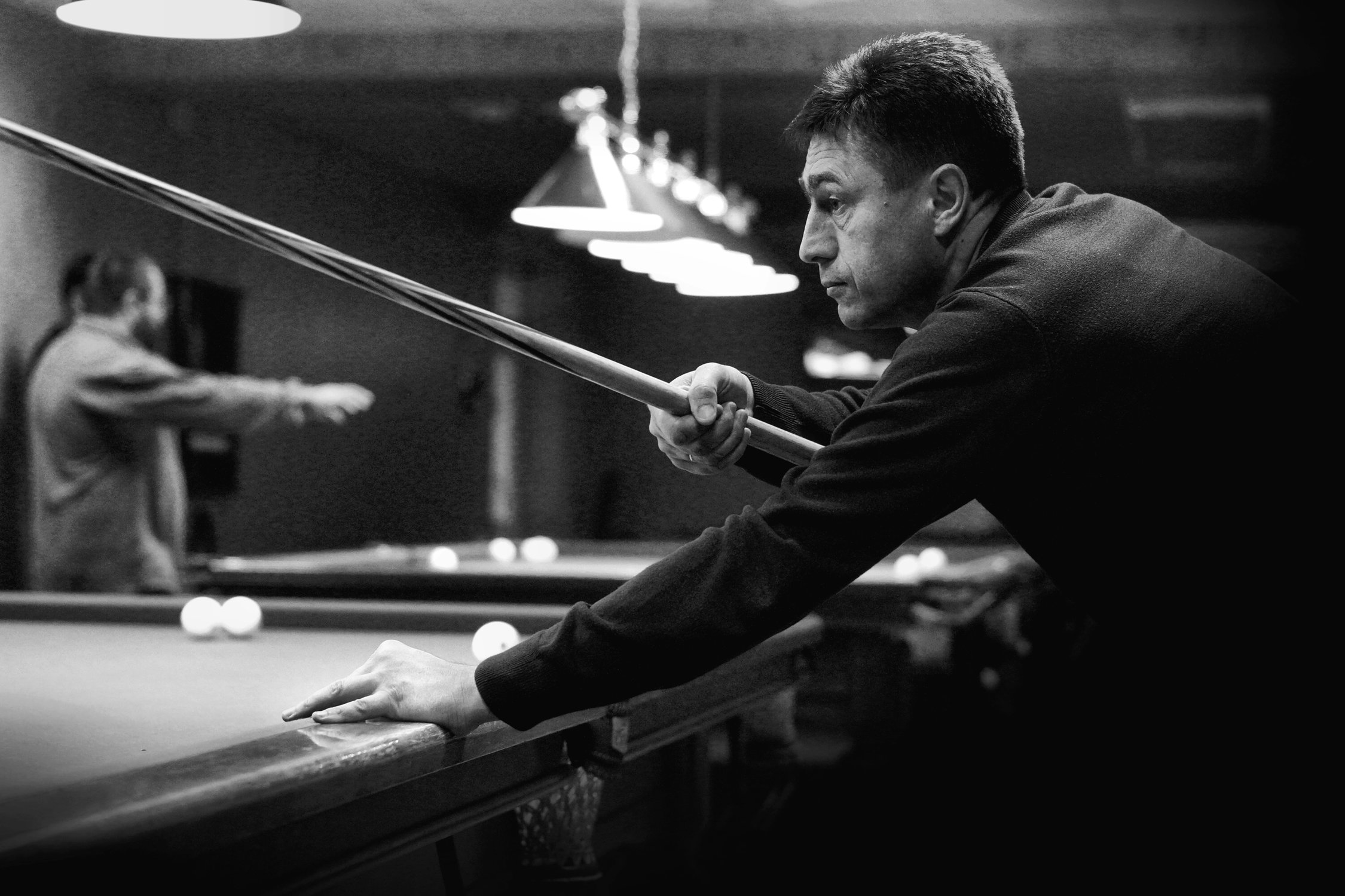 Игрок в бильярд