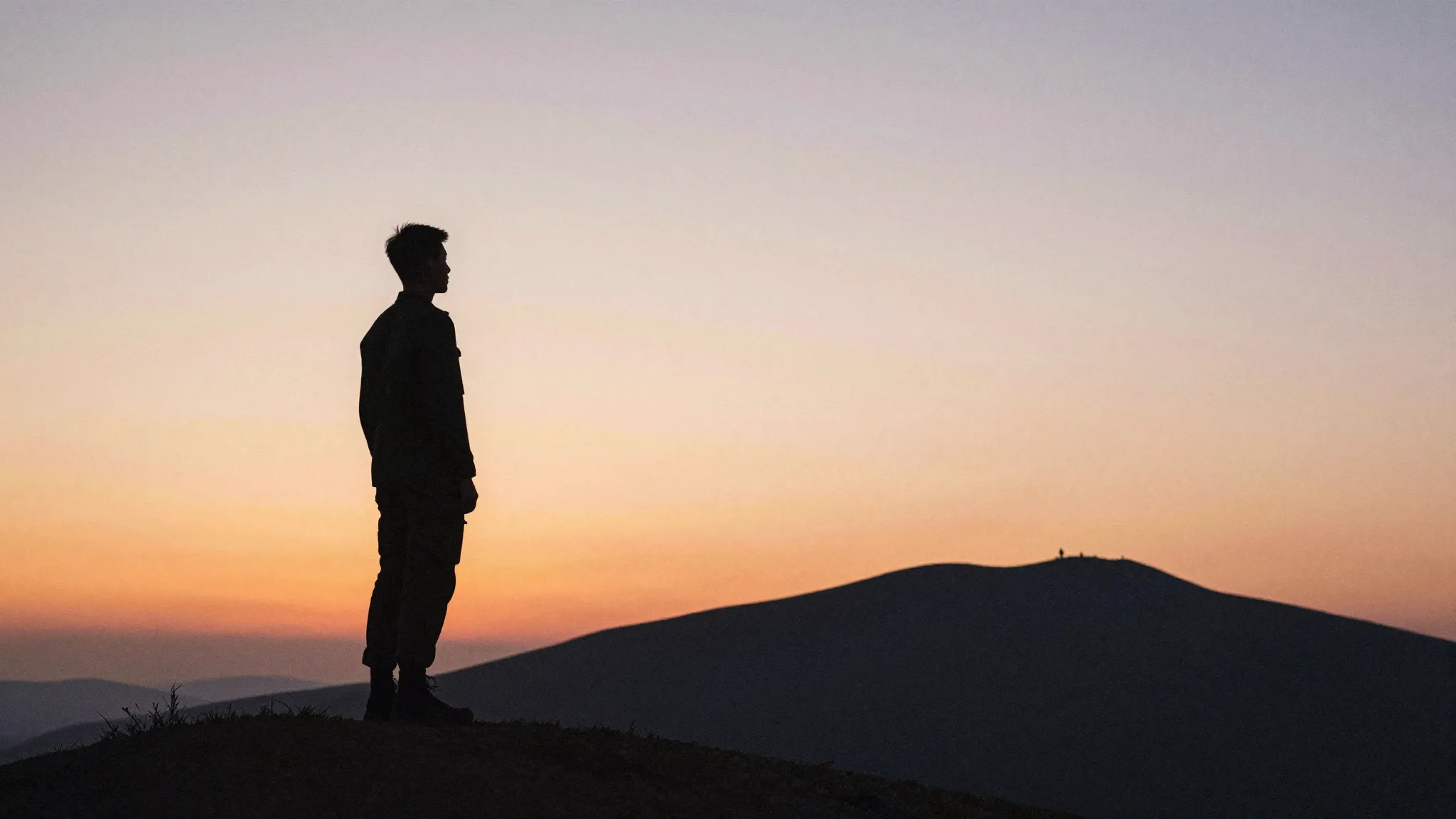 Watercolor style. A solitary silhouette of a young man stand...