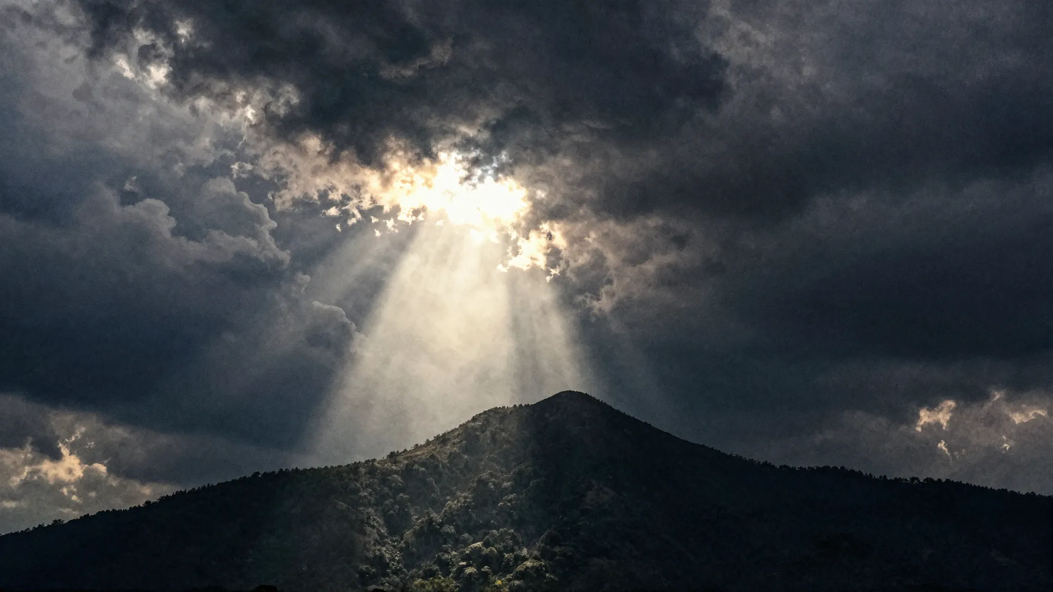 Watercolor style. Dark stormy sky with a single bright sun r...